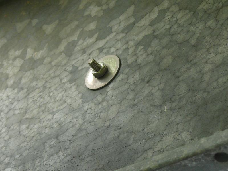 P1150631.JPG - Detail of the tightening end of the stainless plant supports strung horizontally at one foot intervals.  We used stainless fender washers because the hole needed to be drilled before galvanizing.  Galvanizing tends to close up holes so they are 1/2" -- considerably larger than the 1/4" threaded fitting.