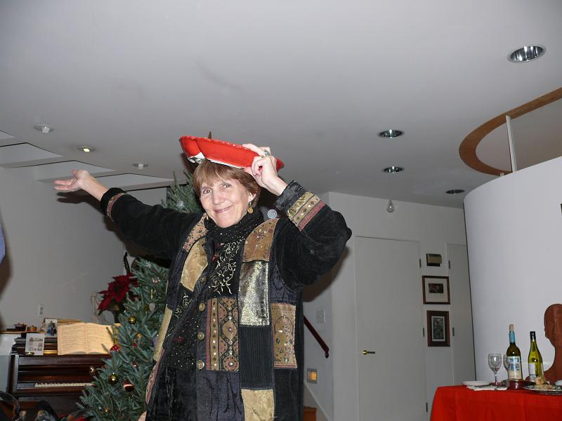 P1190633.JPG - Mary adapts a serving plate as a hat.