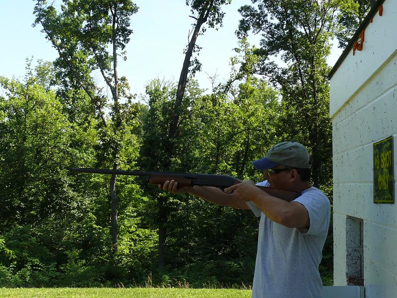 P1160867.JPG - Woody tries to make friends with the pump action gun -- by nailing two clays in a row.