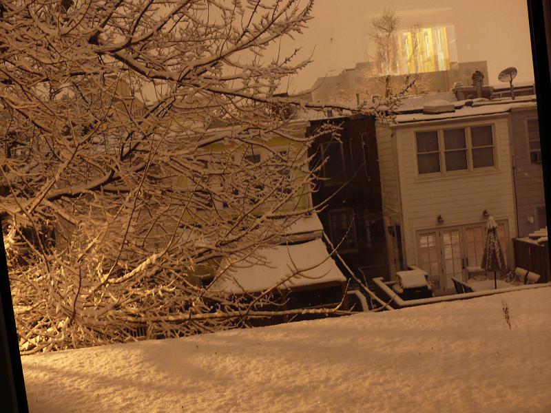P1160094.JPG - Night time view of Newport Place from Win's roof as the snow begins.  Looking South.
