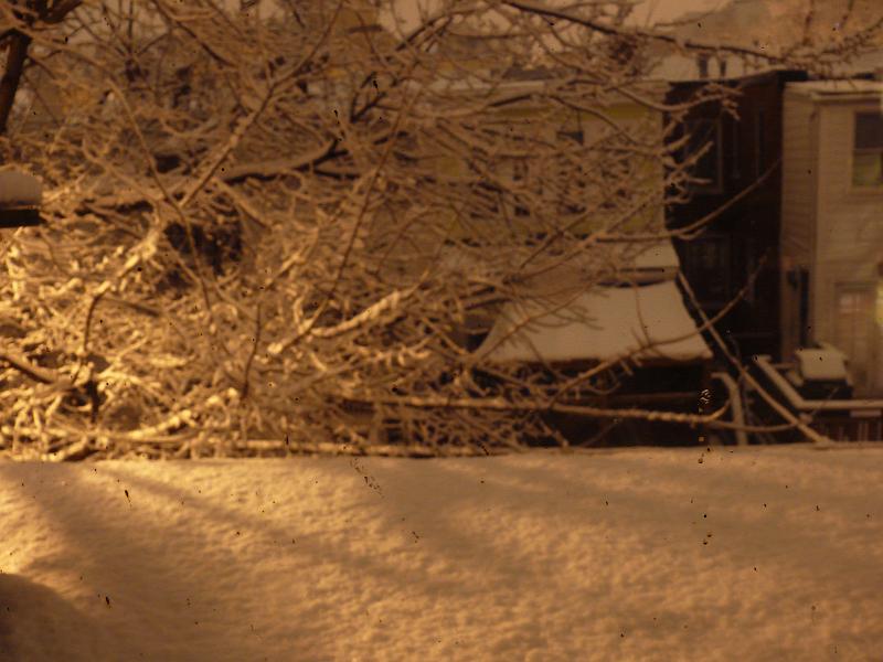 P1160095.JPG - Night time view of Newport Place from Win's roof as the snow begins.  Looking North over the alley.